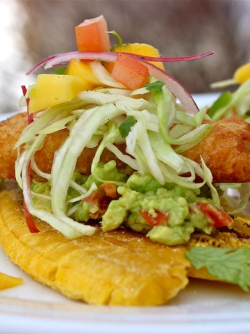 Fried Green Plantains with Guacamole, Crispy Battered Fish Fillets and Mango Slaw