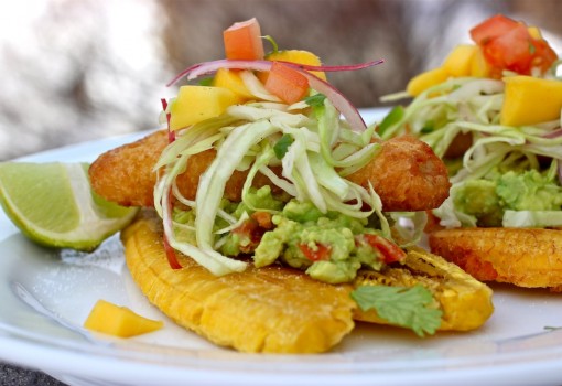 Fried Green Plantains with Guacamole, Crispy Battered Fish Fillets and Mango Slaw