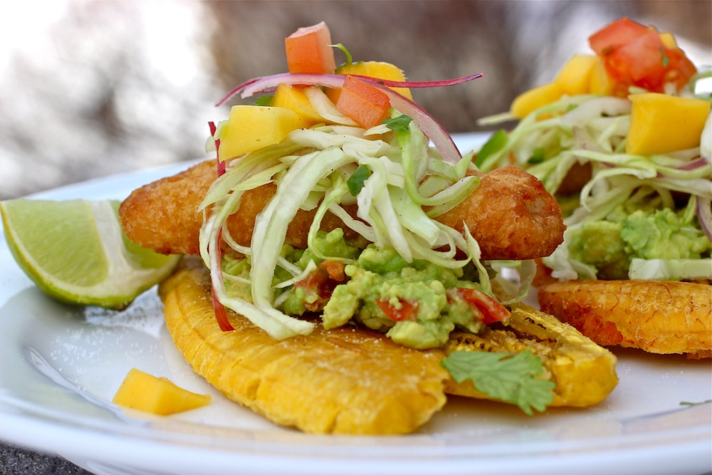 Fried Green Plantains with Guacamole, Crispy Battered Fish Fillets and  Mango Slaw