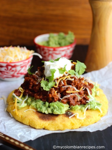 Arepas with Beef Chili, Guacamole and Cheese |mycolombianrecipes.com