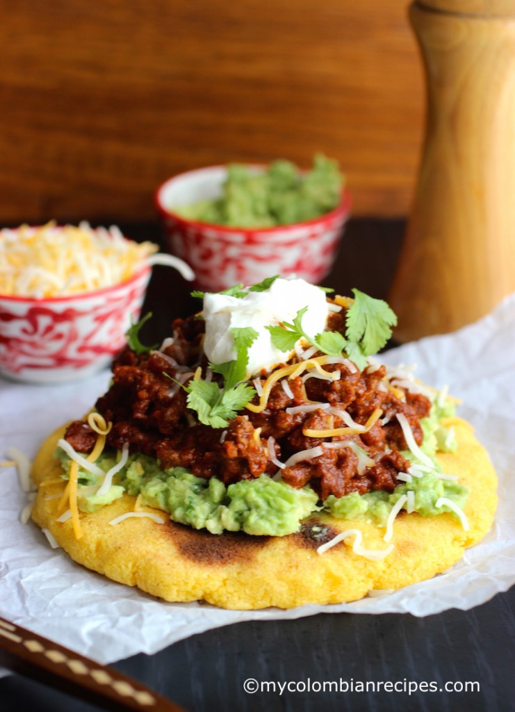 Arepas with Beef Chili, Guacamole and Cheese |mycolombianrecipes.com