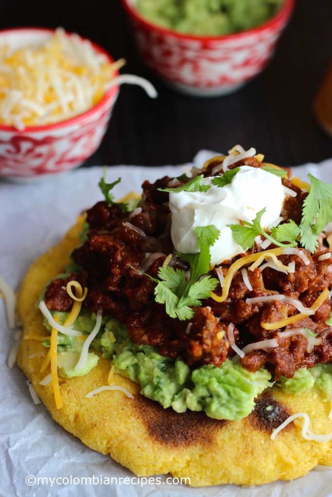 Arepas with Beef Chili, Guacamole and Cheese |mycolombianrecipes.com