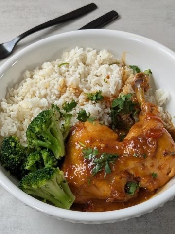 Chicken legs in Orange sauce with White Rice and Broccoli